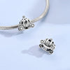 Sterling silver devil's eye charm bracelet featuring a detailed charm and chain.