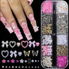 A collection of pink and white butterfly bow nail charms, including various glitter, pearl, and floral designs.