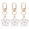 Llavero floral dorado con dije en forma de corazón para llaves y bolsos