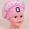 Pink A-Z letter sleep cap for kids with a ruffled toque