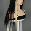A woman with long straight blonde hair is shown wearing a black top, with a white chair in the background.