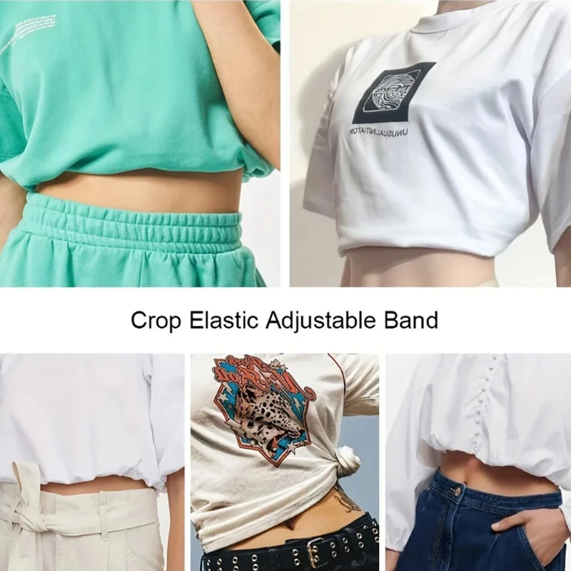 Close-up of a white crop top featuring a graphic design and elastic adjustable band detail.