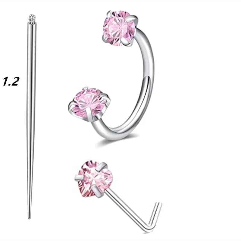 A set of silver-toned horseshoe nose rings, including a straight stud and a curved hoop with pink gemstone accents.