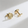 A pair of elegant gold-toned cufflinks featuring a checkered pattern and a bar design.