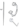 A set of silver horseshoe nose rings, including a straight stud and a hoop with a clear stone.