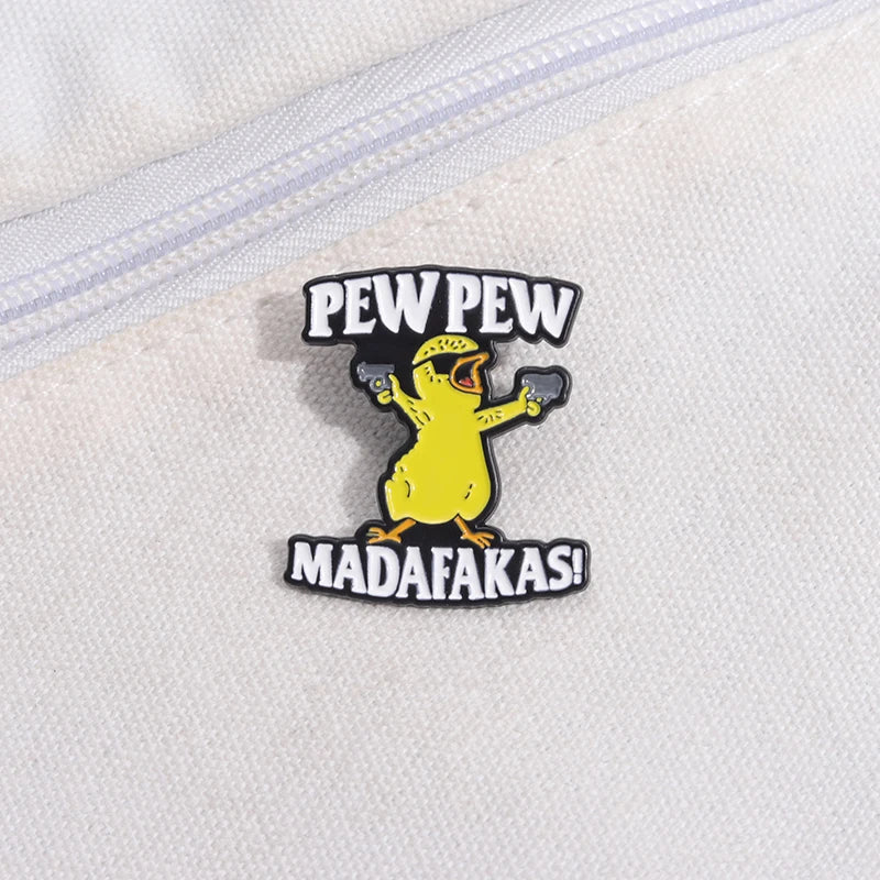 A yellow chicken enamel lapel pin featuring the text PEW PEW and MADAFAKAS!