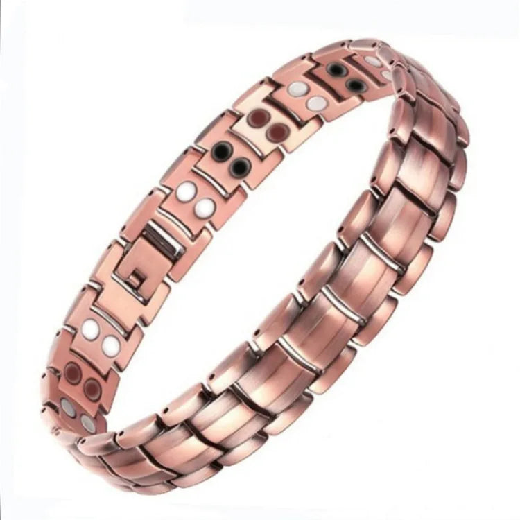 A close-up view of a rose gold copper magnetic therapy bracelet with small white accents.