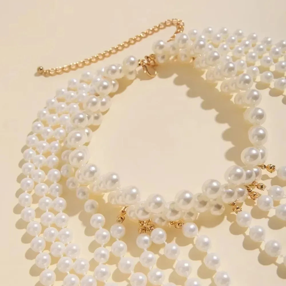 A set of imitation pearl statement necklaces displayed against a light background.