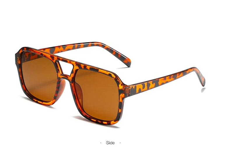 Orange und schwarz gepunktete Vintage-Pilot-Sonnenbrille von der Seite.