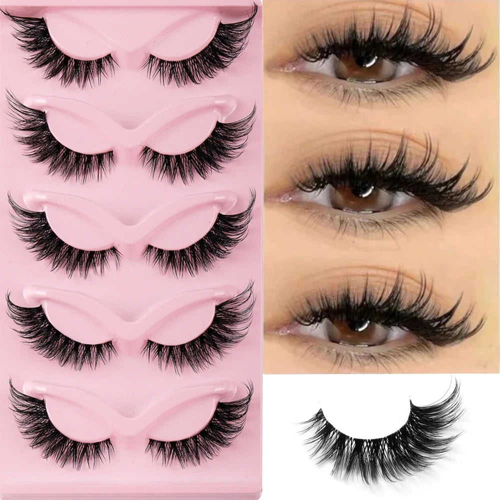 A pink plastic tray displaying various styles of black false cat eye strip eyelashes.