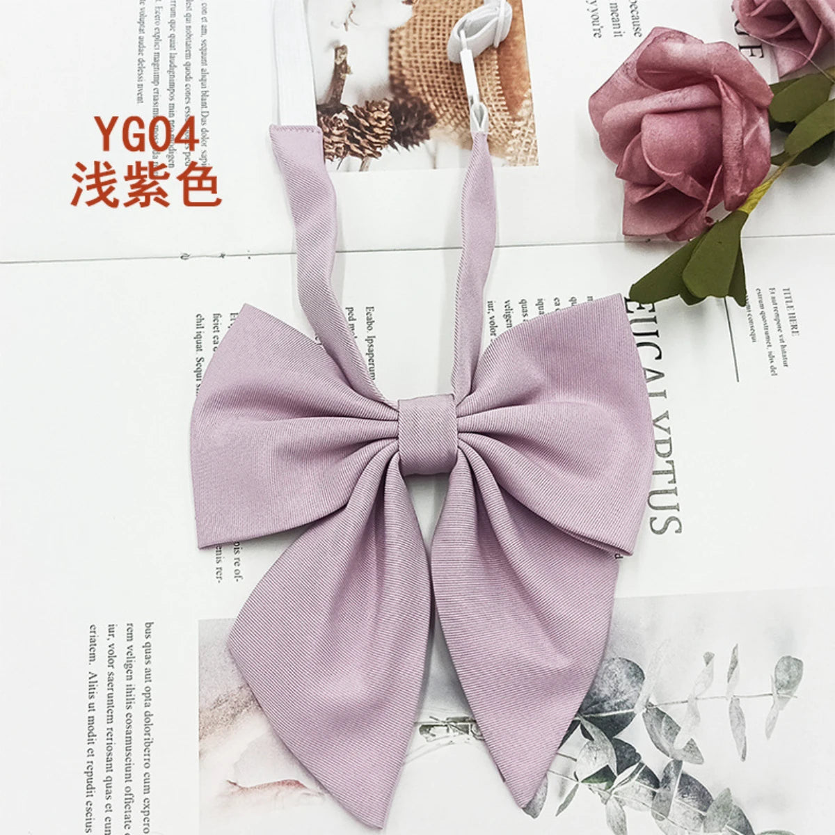 A solid lavender cotton bow tie tied in a bow shape, displayed on a white background.