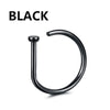 A black hoop nose ring or jewelry item.