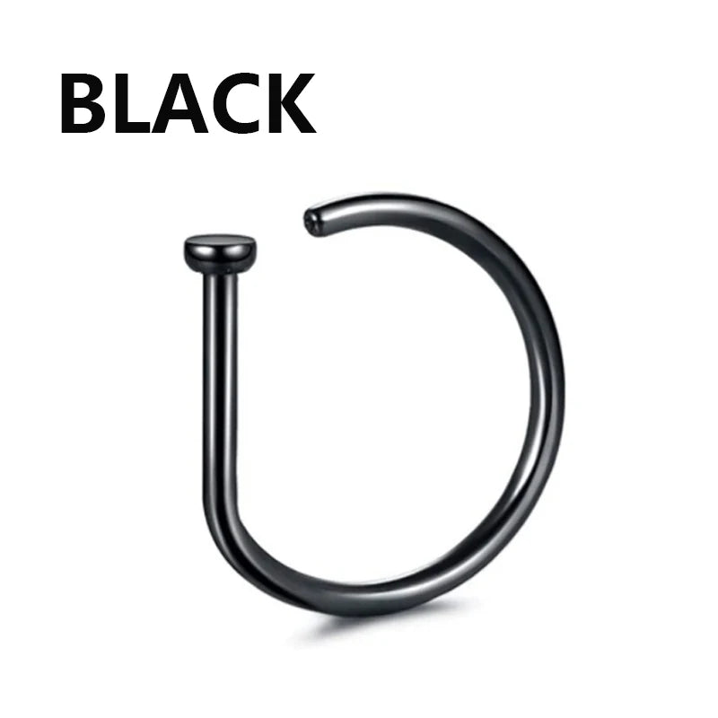 A black hoop nose ring or jewelry item.