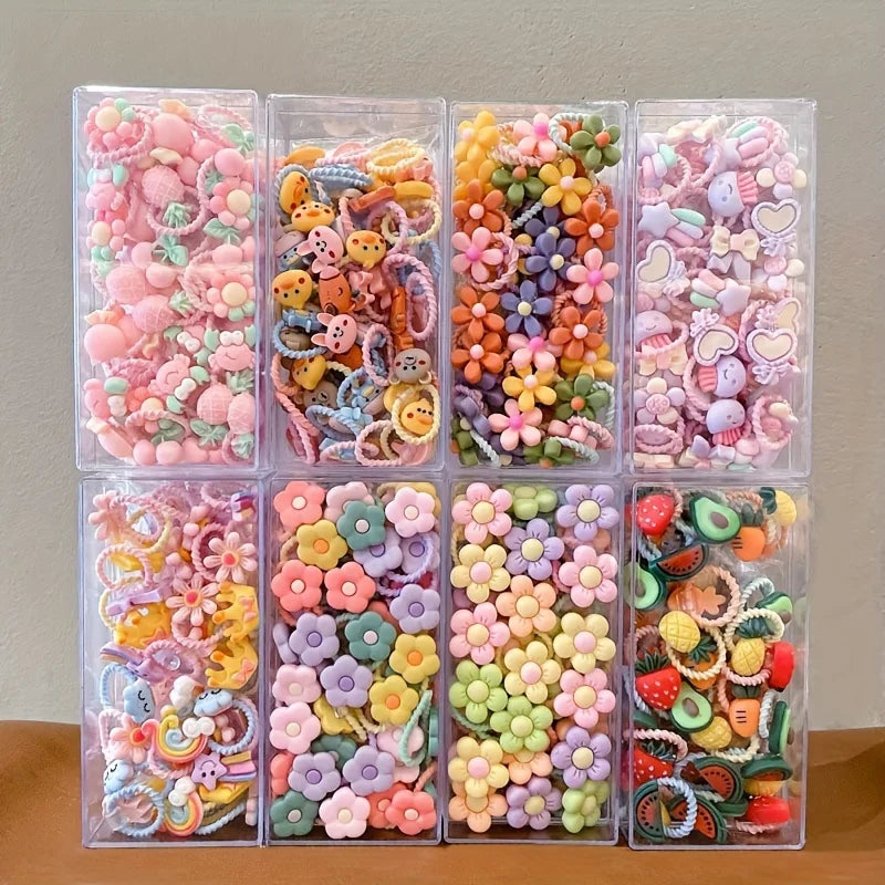 A collection of colorful decorative elastic hair bands for girls in various pastel and vibrant colors.