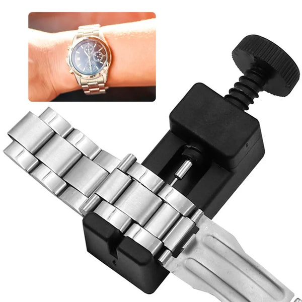A precision watch band link pin remover tool is shown with a silver watch band and a black clamping mechanism.