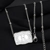 Silver initial letter pendant necklace with a heart charm and delicate chain displayed on black fabric.