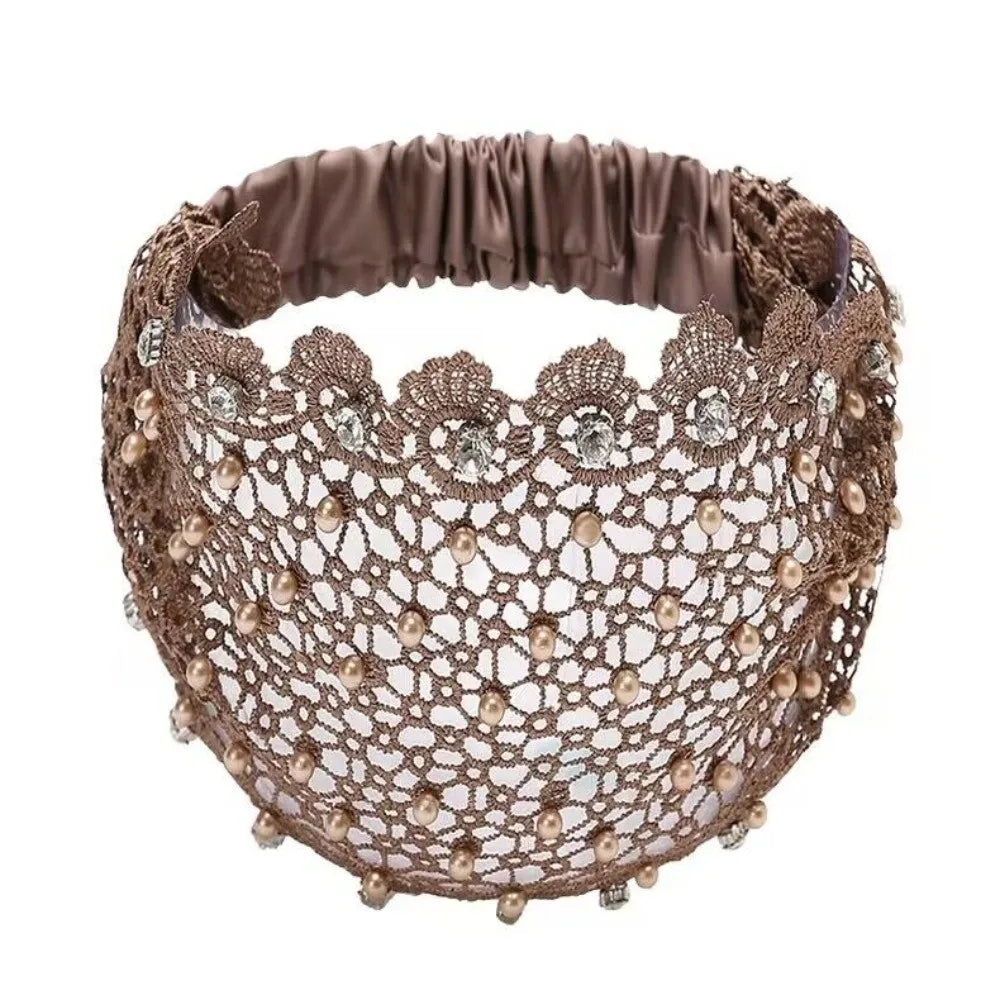 A brown beaded headband adorned with crystals and pearls, featuring a floral pattern.
