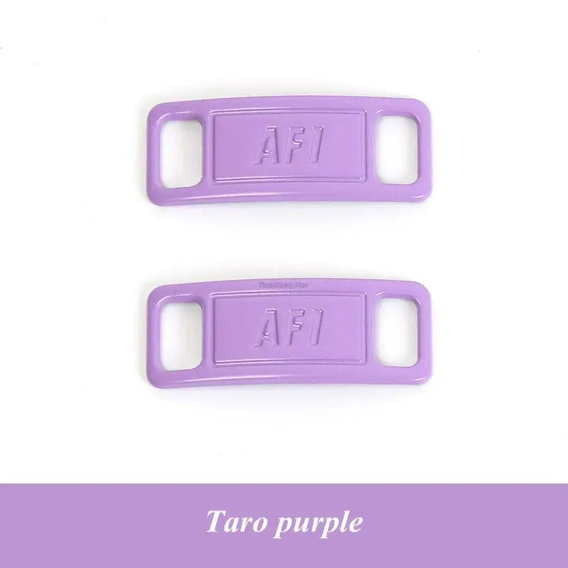 Two purple AFI diamond shoe charms and laces