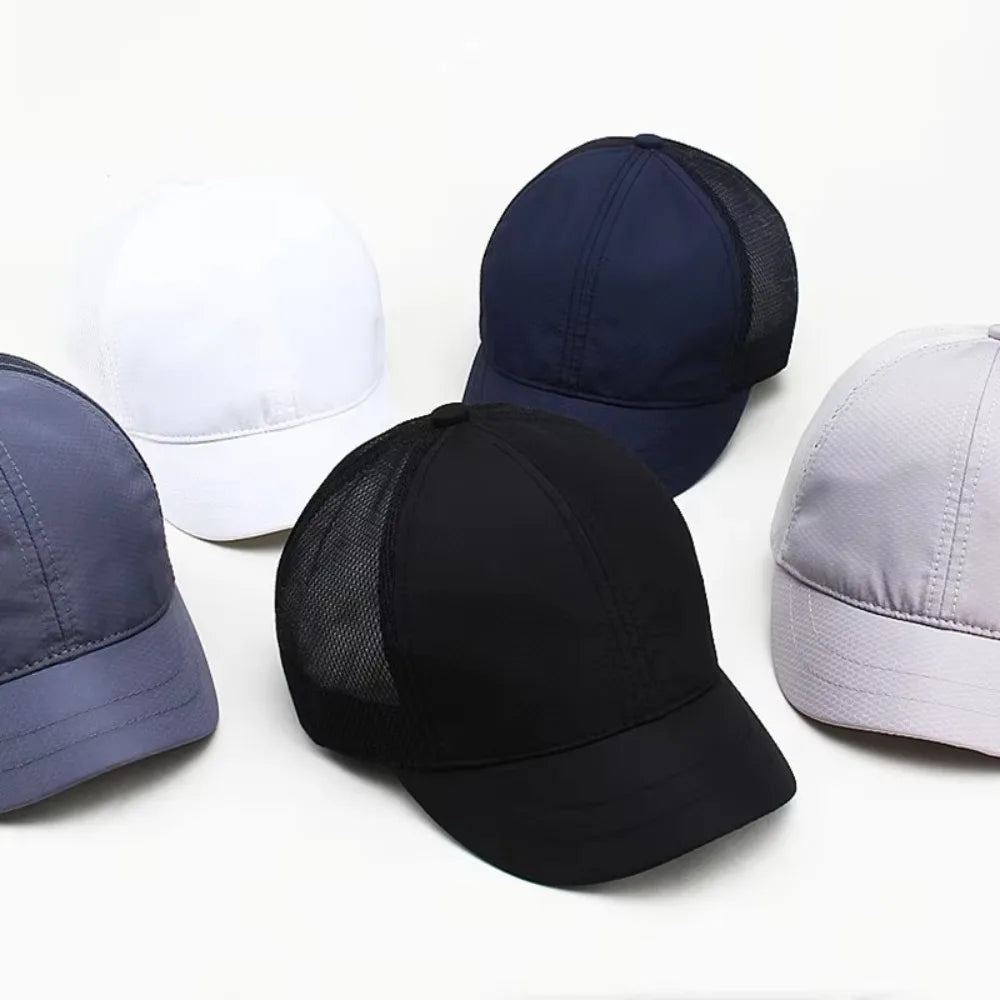 A collection of five mesh sun visor caps in white, navy blue, black, and light gray are displayed on a white background.