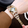 A close-up of a gold and diamond-inlaid quartz wristwatch worn on a wrist.