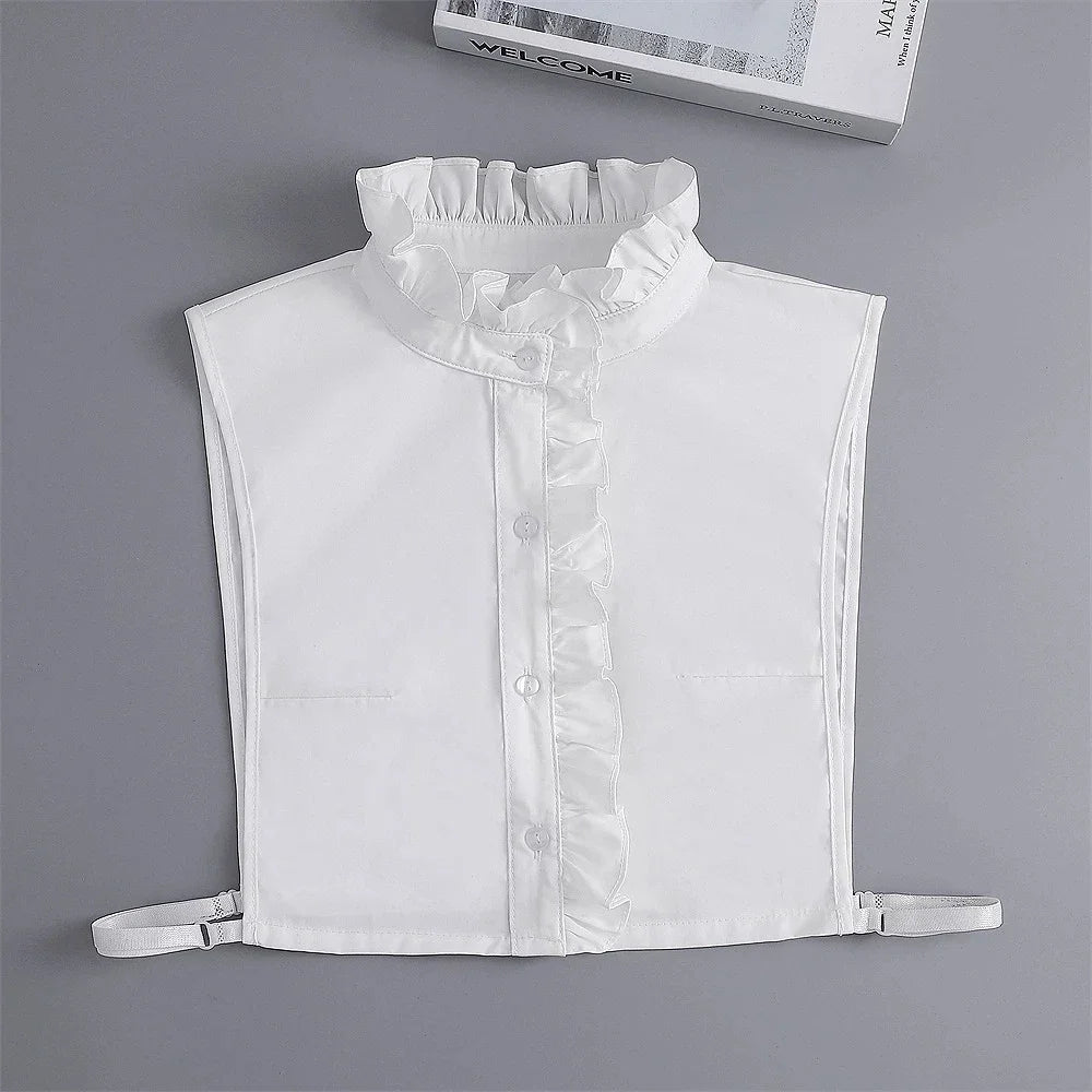 White blouse with a ruffled false collar and detachable neckline