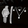Ein Set eleganter Quarz-Kristall-Armbanduhren und Halsketten für Damen auf schwarzem Hintergrund.