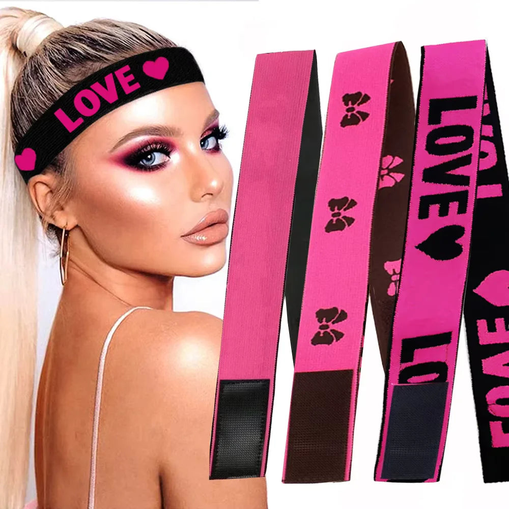 A model wearing a black love headband and displaying several pink and black elastic bands for wig edges.