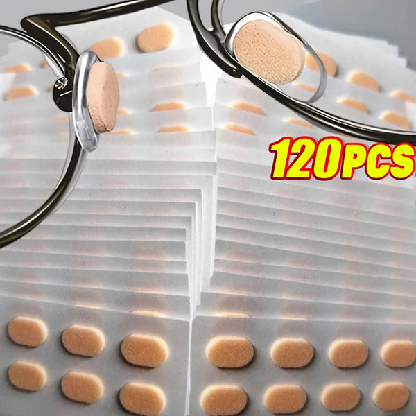 A close-up view of reusable anti-slip eyeglass nose pads in various shades and sizes, packaged for sale.