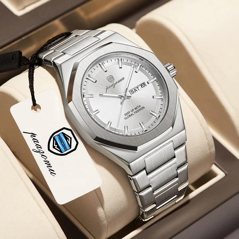 A silver stainless steel watch with a black strap is displayed in a light-colored box.