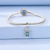 Sterling silver devil's eye charm bracelet with a round centerpiece and a charm of a small figure