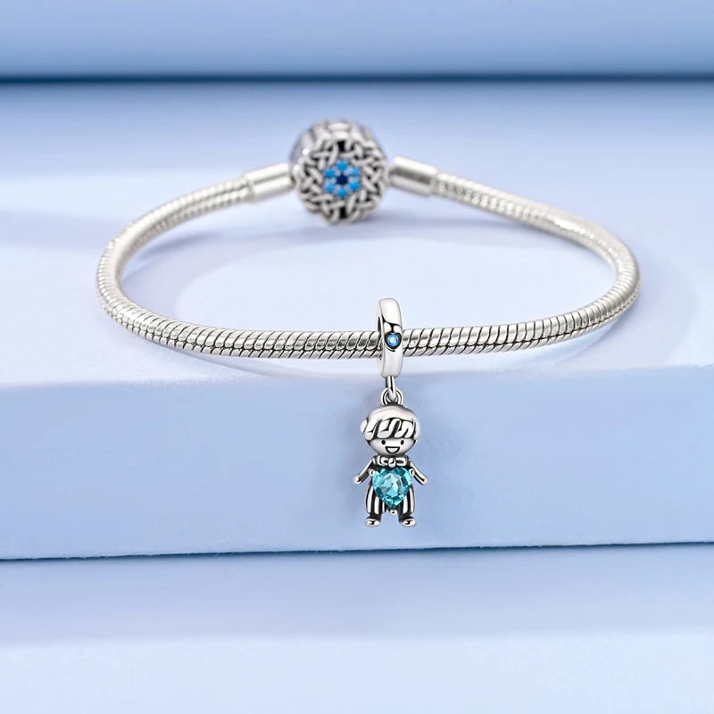 Sterling silver devil's eye charm bracelet with a round centerpiece and a charm of a small figure