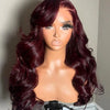 A model displays a long, wavy burgundy human hair wig on a display stand.