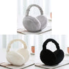 A set of plush fur ear warmers or earmuffs in gray and black colors displayed on a white surface.