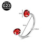 A silver titanium nose ring featuring a red cubic zirconia crystal gemstone.
