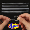 A set of four clear invisible ring size adjusters is shown being held by a hand.