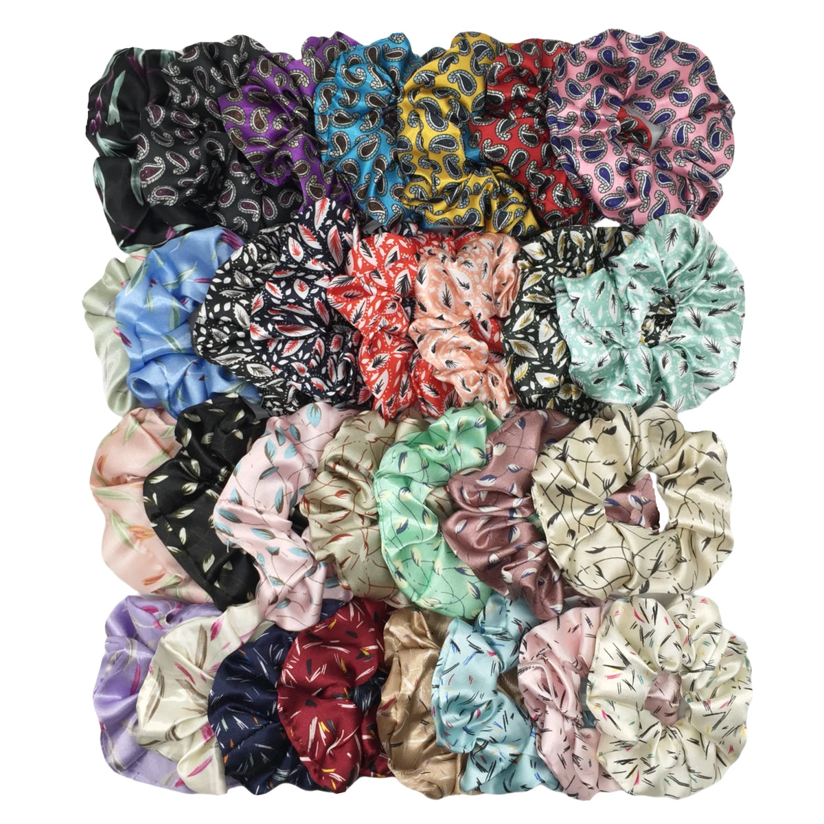 Una colección de seis gomas para el pelo con estampado floral de satén en varios colores y patrones.