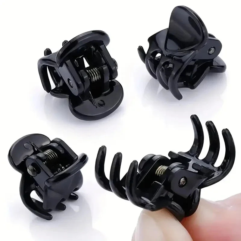 A set of black adjustable hair claw clips shown in various angles and on a finger.