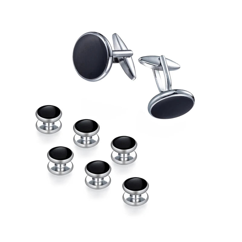 Un set élégant de boutons de manchette et de clips de cravate, avec des accents en métal argenté et onyx noir ou émail.