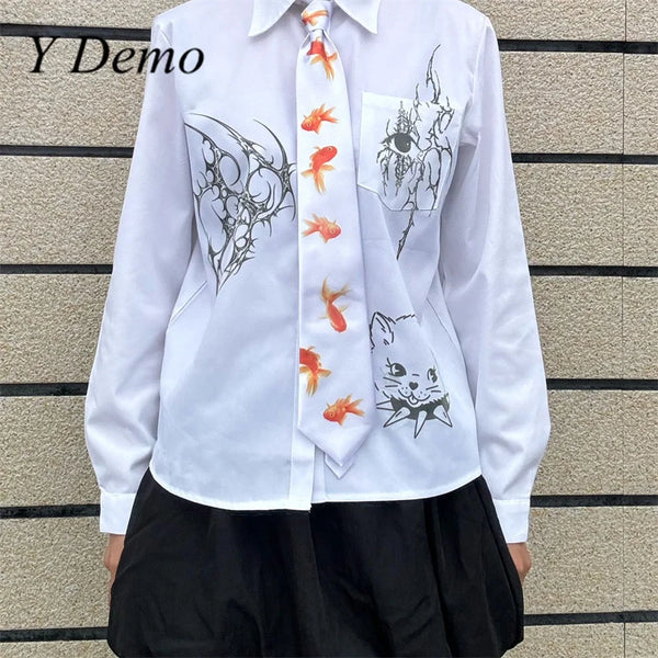 White long-sleeved shirt with a goldfish print tie and decorative ink designs