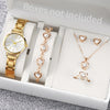A white box contains a gold-toned quartz wristwatch, a diamond necklace, and a ring.