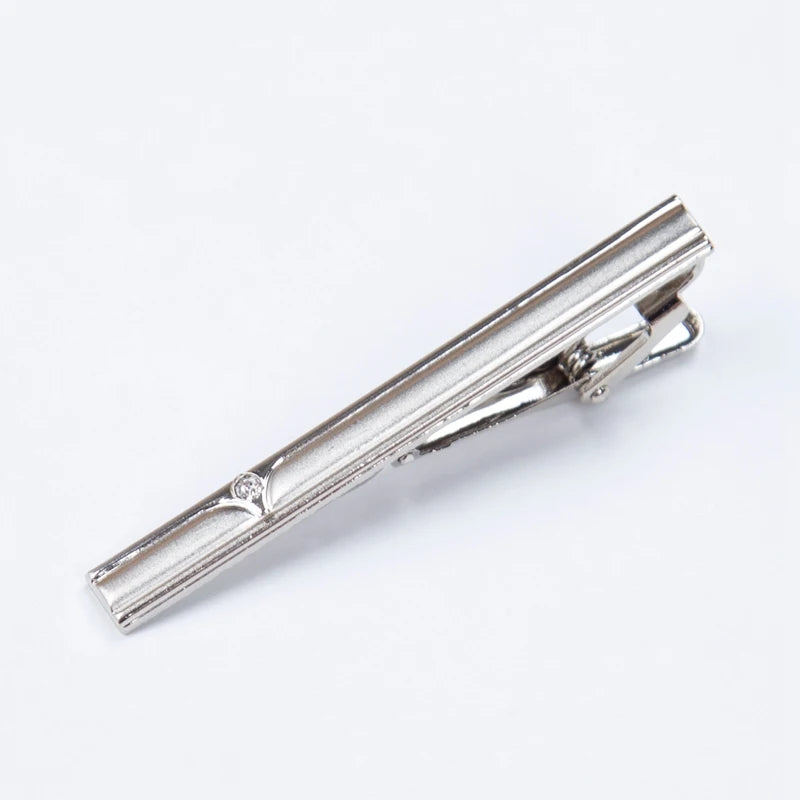 Silver metal tie clip for men's neckties shown in a close-up view.