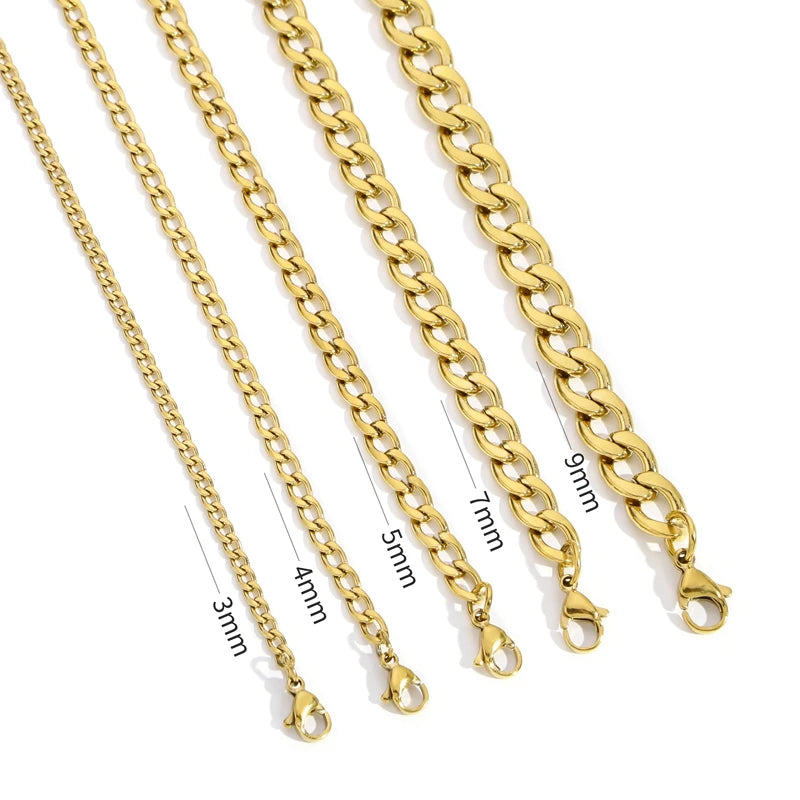 A collection of gold-colored stainless steel Cuban link necklaces of varying lengths displayed against a white background.