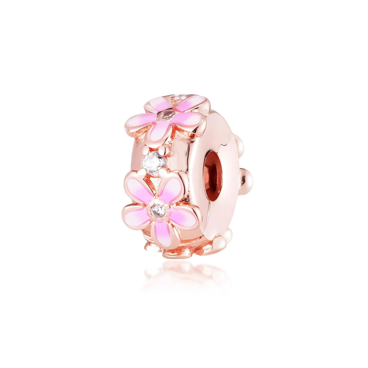 Un adorno de color rosa dorado con una flor y un pequeño acento de diamante.