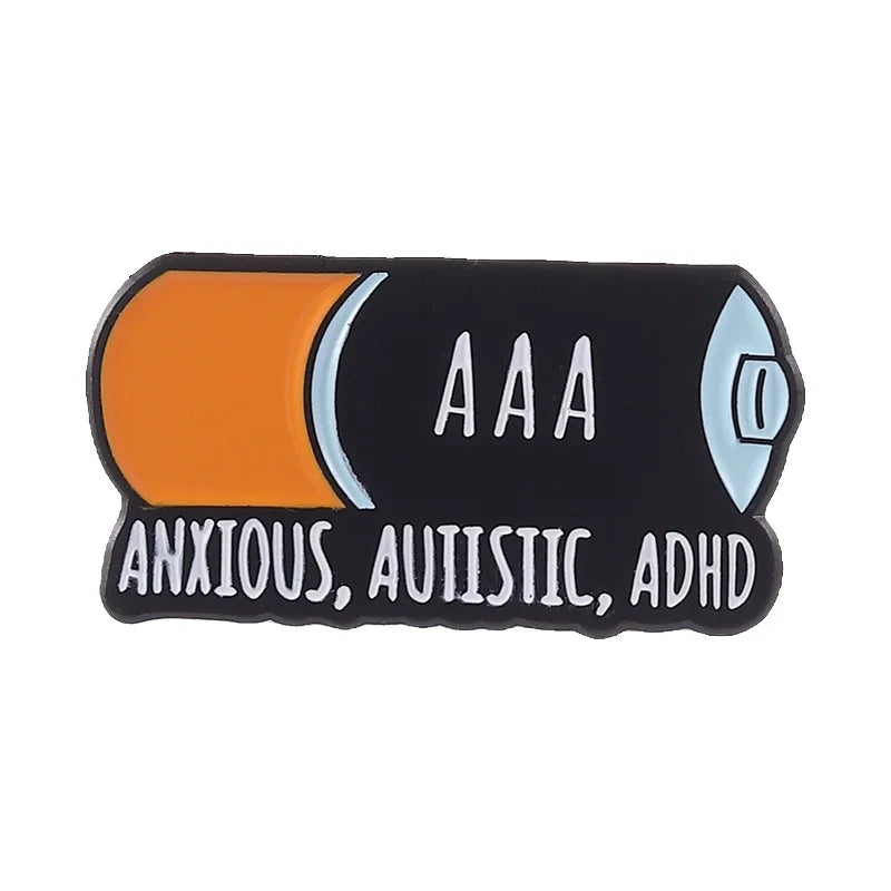 Black enamel lapel pin with an orange and blue design featuring the text ANXIOUS, AUTISTIC, ADHD
