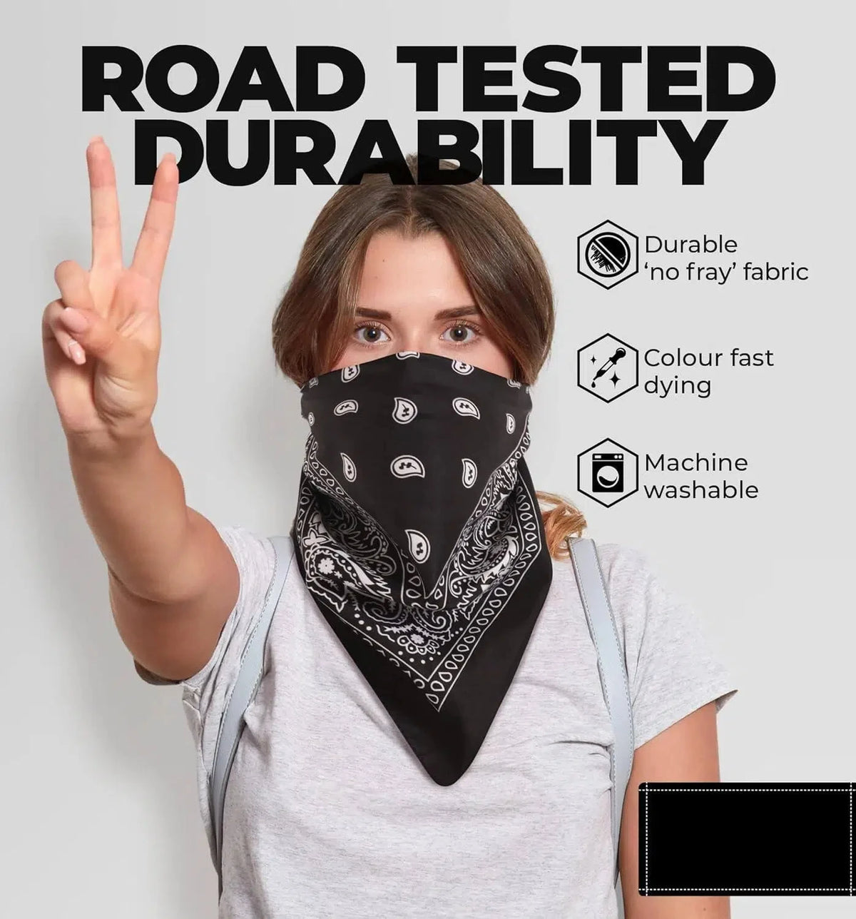 A woman models a black paisley bandana headband, highlighting its durable fabric and washability features.
