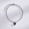 A sterling silver double heart charm bracelet with a delicate chain and a small heart pendant.