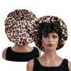 A woman wearing a leopard print satin sleep bonnet on a mannequin.