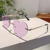 Vintage Herzform-Sonnenbrille ohne Rand mit lila Linsen und goldfarbenen Metallrahmen