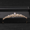Gold-toned bridal tiara headpiece adorned with clear crystals and rhinestones displayed in a black box.