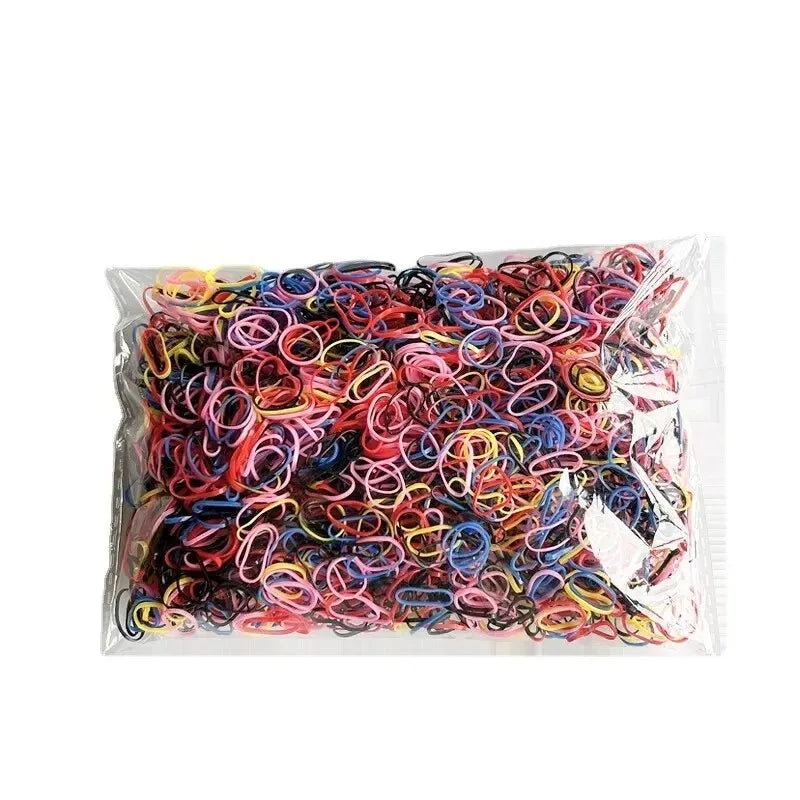 A clear plastic package filled with numerous colorful disposable rubber hair ties.